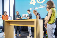 Handover from Dr Georg Baumann to Oskar Baumann - symbolised by a 3D model.